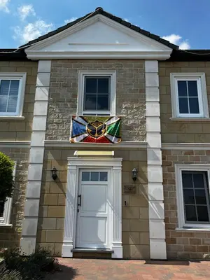 a house with a stained glass window above the door at Tommorowland in Niel