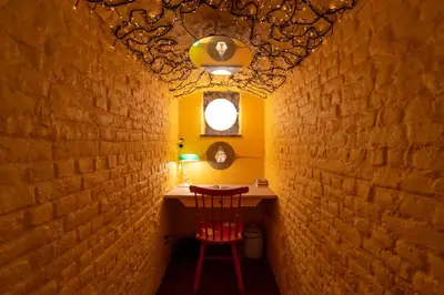 a small room with a table and a chair in a wall at Saint Catherine Art Residence in Brussels
