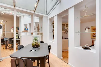 a dining room with a table and chairs at Saint Catherine Art Residence in Brussels
