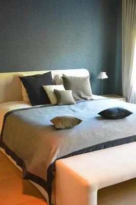 a bed with two pillows on it in a room at B & B Landhuis Ter Velt in Melle