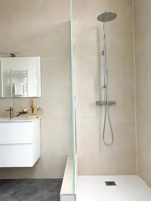 a shower with a glass door in a bathroom at New Cozy Apartments In Porte de HAL in Brussels