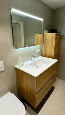 a bathroom with a sink and a mirror and a toilet at J1 - Urban studio in Antwerp in Antwerp