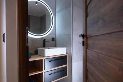 a bathroom with a sink and a mirror at Meerbeek Unwind in Kortenberg