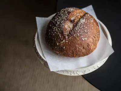 a loaf of bread sitting on top of a plate at Stil 1827 in Sint-Laureins