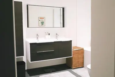 a bathroom with a sink and a mirror at Luxury 2 Bedroom - Antwerp City Centre in Antwerp