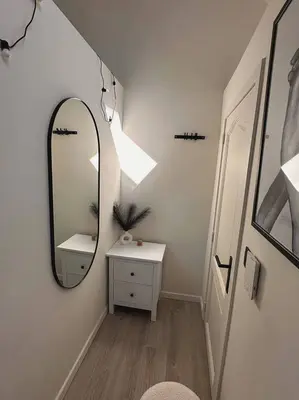 a bathroom with a mirror and a white table at Skyroof à Ixelles - Viaduc in Brussels