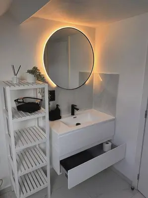 a bathroom with a white sink and a mirror at Skyroof à Ixelles - Viaduc in Brussels