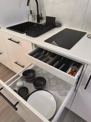 a kitchen with a sink and a drawer with dishes at Skyroof à Ixelles - Viaduc in Brussels