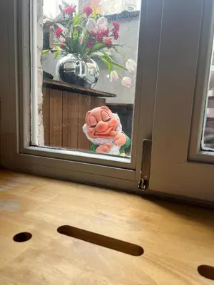 a door open to a window with a teddy bear at Agelandkaai (.be) Free Parking in Ghent