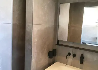 a bathroom with a mirror and a sink at Agelandkaai (.be) Free Parking in Ghent