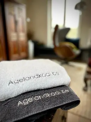 a pile of towels sitting on top of a table at Agelandkaai (.be) Free Parking in Ghent