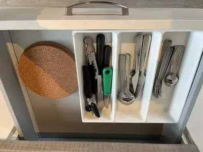 a drawer full of kitchen utensils in a cabinet at Sint-Amandstraat studio B4 in Ghent