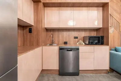a kitchen with a sink and a dishwasher at luxueux appartement 5 chambre in Brussels
