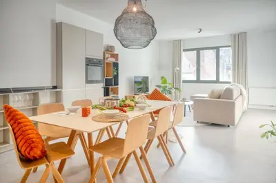 a kitchen and dining room with a table and chairs at Wonderful 6P duplex in Antwerp in Antwerp