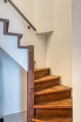 a staircase in a house with wooden steps at Wonderful 6P duplex in Antwerp in Antwerp