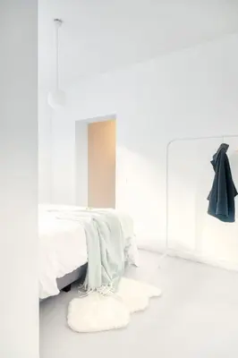 a white bedroom with a bed and a mirror at Wonderful 6P duplex in Antwerp in Antwerp