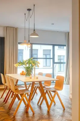 a dining room with a table and chairs at Ample 2-BR Apt in Antwerp in Antwerp
