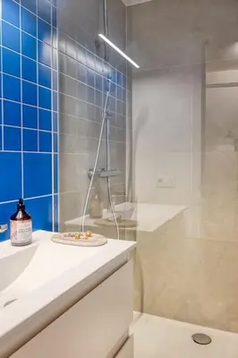 a bathroom with a shower and a sink and a toilet at Ample 2-BR Apt in Antwerp in Antwerp