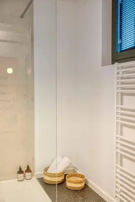 two baskets sitting on a counter in a bathroom at Ample 2-BR Apt in Antwerp in Antwerp
