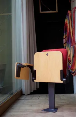 a suitcase sitting on a stand in front of a door at B'Kanal in Brussels