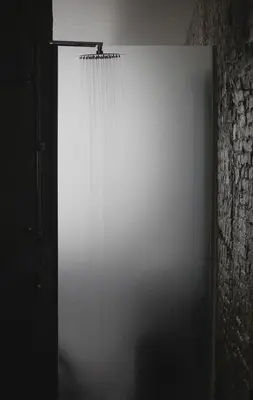 a white door with a curtain in a room at B'Kanal in Brussels