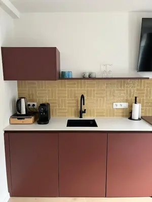 a kitchen with a sink and a counter top at Business Accommodation 'Eclectic Living' Nomad in Geel