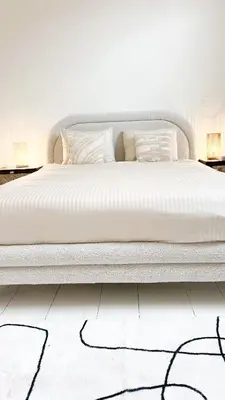 a bedroom with a bed with white sheets and pillows at Mansion RL with Unique Decoration in Antwerp
