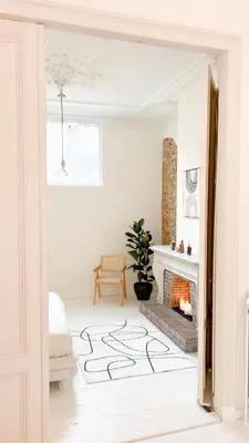a white living room with a fireplace and a bed at Mansion RL with Unique Decoration in Antwerp