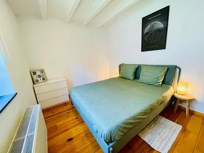 a small bedroom with a bed in a room at Oasis-Spacious Loft in Excellent Location in Brussels