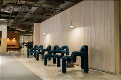 a row of chairs lined up against a wall at Citybox Brussels Centre Louise in Brussels