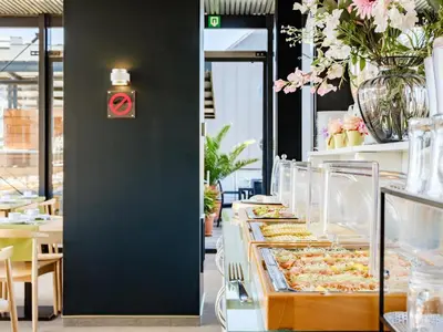 a buffet line with trays of food on display at Budget Rooms by Ghent River in Ghent
