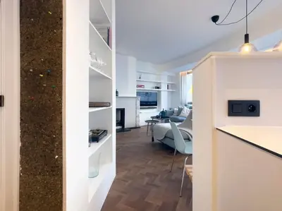 a living room with a couch and a table at Cosy apartment for 2p-4p Ghent in Ghent