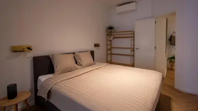 a bedroom with a large bed in a room at Pacific Residences - Studio in Antwerp