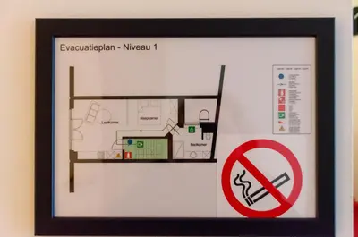 a picture of a floor plan with a no smoking sign at Pacific Residences - Studio in Antwerp
