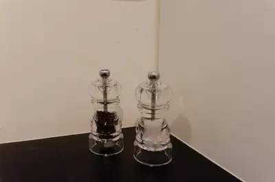 two glass containers sitting on top of a table at Pacific Residences - Studio in Antwerp