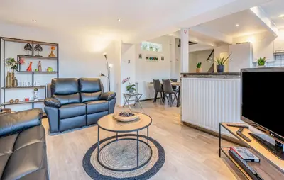 a living room with a couch and a table at 2 Bedroom Beautiful Home In Herselt in Herselt