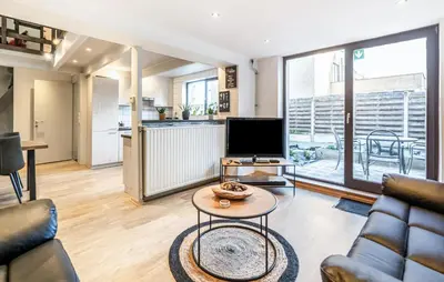 a living room with a couch and a table at 2 Bedroom Beautiful Home In Herselt in Herselt
