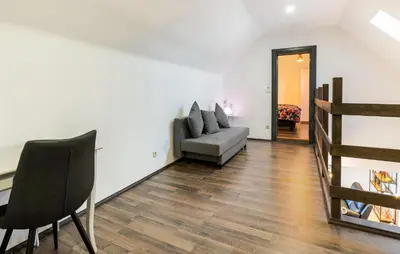 a living room with a couch and a staircase at 2 Bedroom Beautiful Home In Herselt in Herselt