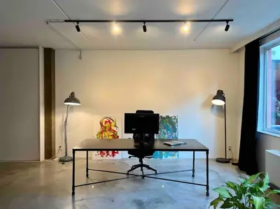 a room with a desk with a computer on it at Loft Antwerp - Eilandje in Antwerp
