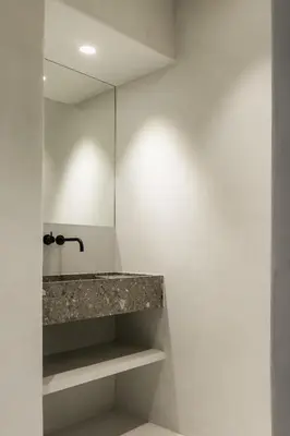 a bathroom with a sink and a mirror at Etablo B&B in Bornem