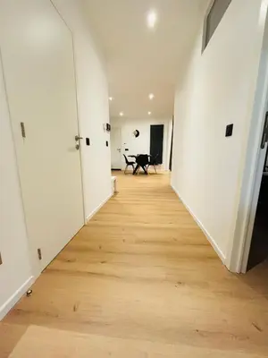 an empty hallway with a piano in a room at Cozy Flat in Brussels