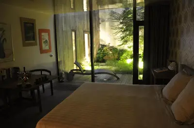 a bedroom with a bed and a sliding glass door at Schopenhauer in Ghent