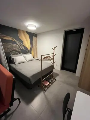 a bedroom with a bed and a painting on the wall at Starling in Oud-Turnhout
