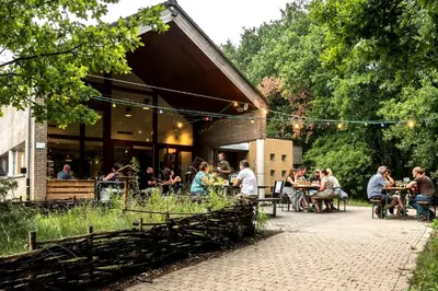 a group of people sitting at tables outside of a restaurant at Starling in Oud-Turnhout