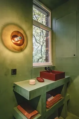 a green bathroom with a sink and a window at Your colourful Antwerp Oasis in Antwerp