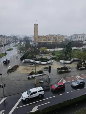 a city street with cars parked in a parking lot at Luxurious 3 in Brussels