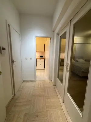 a corridor of a room with a hallway at Studio Winston Churchill in Brussels