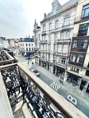 a view from a balcony of a city street with buildings at Magnifique appartement au coeur du SABLON ! in Brussels