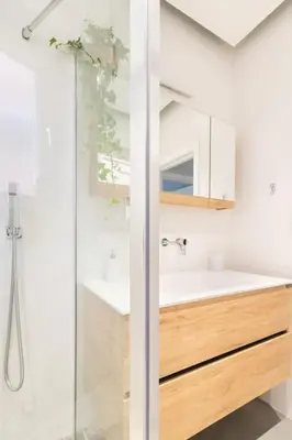 a bathroom with a sink and a shower at European heart 2-bedroom flat. in Brussels