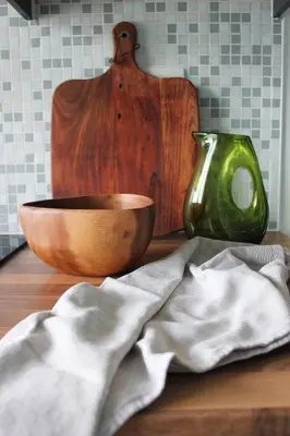 a wooden bowl and a green mixer on a counter at Sunny Apartment - Zuid Retreat 1BR Apartment near Scheldt River in Antwerp